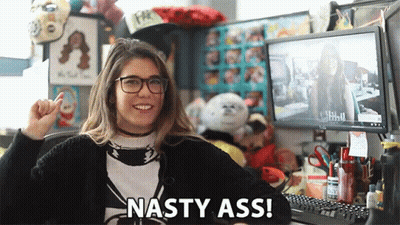 A Woman Sitting In Front Of A Computer With The Words Nasty Ass Written On The Bottom GIF