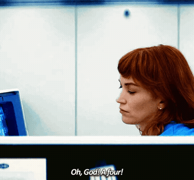 A Woman Sitting In Front Of A Computer With The Words Oh God A Four Written Below Her GIF