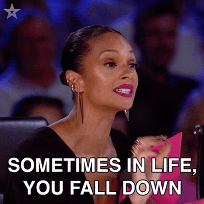 A Woman Sitting In Front Of A Crowd With The Words " Sometimes In Life You Fall Down " GIF
