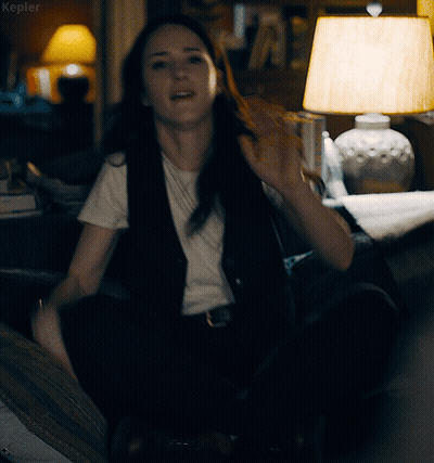 A Woman Sitting In Front Of A Lamp With The Word Kepler On The Bottom Left GIF