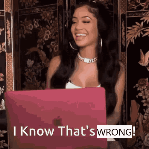 A Woman Sitting In Front Of A Laptop With The Words " I Know That 'S Wrong " GIF