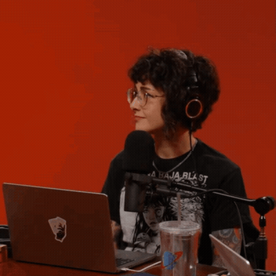 A Woman Sitting In Front Of A Microphone With The Word Parlay Written On The Bottom GIF