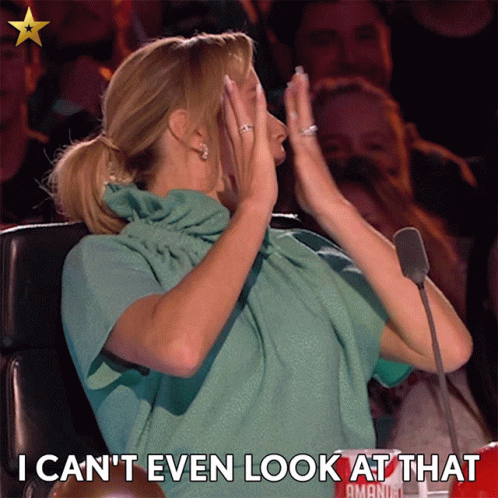 A Woman Sitting In Front Of A Microphone With The Words I Can 'T Even Look At That Below Her GIF