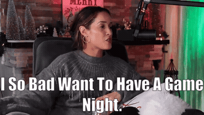 A Woman Sitting In Front Of A Microphone With The Words " I So Bad Want To Have A Game Night " GIF