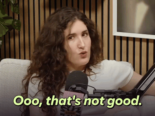 A Woman Sitting In Front Of A Microphone With The Words " Ooo That 'S Not Good " Above Her GIF