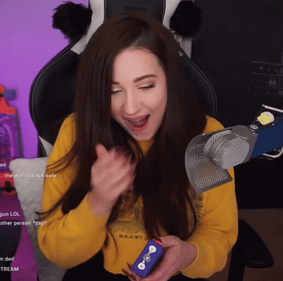 A Woman Sitting In Front Of A Microphone With The Words " The World Is Not Safe " On The Bottom Right GIF