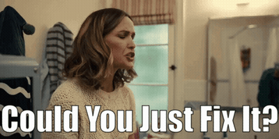 A Woman Sitting In Front Of A Mirror With The Words " Could You Just Fix It " Above Her GIF