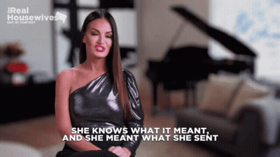 A Woman Sitting In Front Of A Piano With The Words She Knows What It Meant And She Meant What She Sent GIF