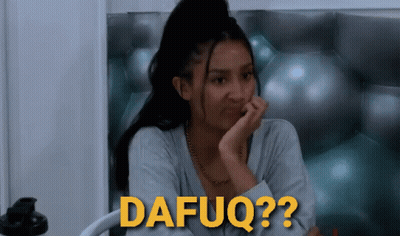 A Woman Sitting In Front Of A Wall With The Word Dafuq Written In Yellow GIF