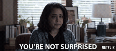 A Woman Sitting In Front Of A Window With The Words You 'Re Not Surprised Netflix GIF