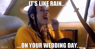A Woman Sitting In The Back Seat Of A Car With A Caption That Says It 'S Like Rain On Your Wedding Day . GIF