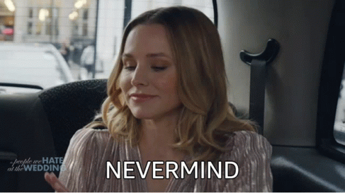A Woman Sitting In The Back Seat Of A Car With The Word Nevermind On Her Face GIF