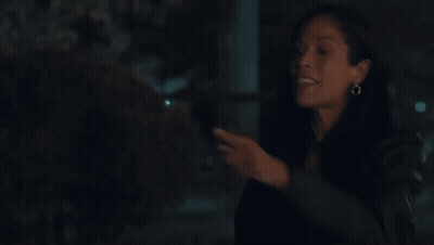 A Woman Sitting On A Bench Wearing A Free Spirit Sweatshirt GIF