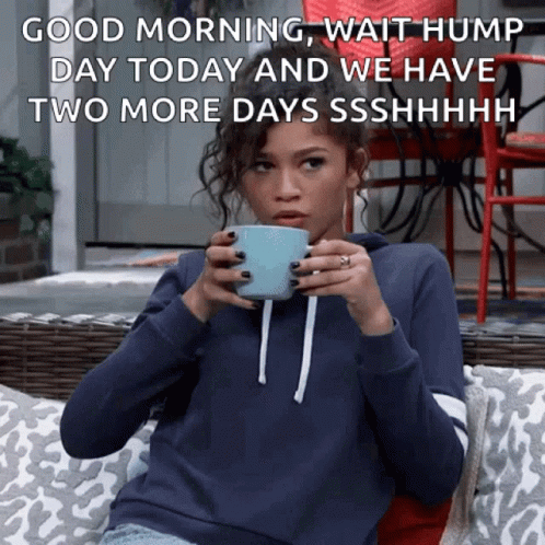 A Woman Sitting On A Couch Holding A Cup Of Coffee With A Caption That Says Good Morning GIF