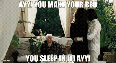 A Woman Sitting On A Couch With A Caption That Says Ayy You Make Your Bed You Sleep In It GIF