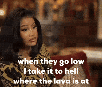 A Woman Sitting On A Couch With A Caption That Says When They Go Low I Take It To Hell GIF