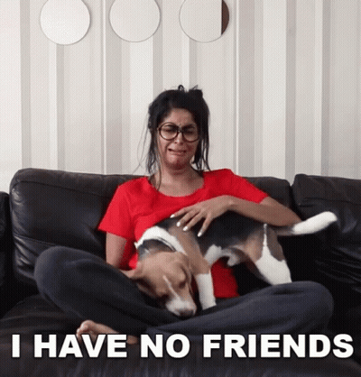 A Woman Sitting On A Couch With A Dog And The Words I Have No Friends GIF