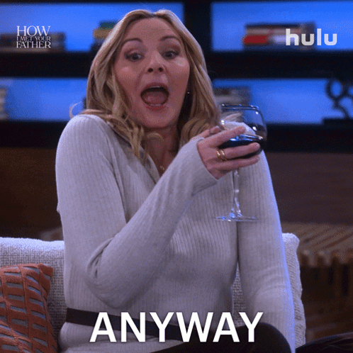 A Woman Sitting On A Couch With A Glass Of Wine And The Word Anyway GIF