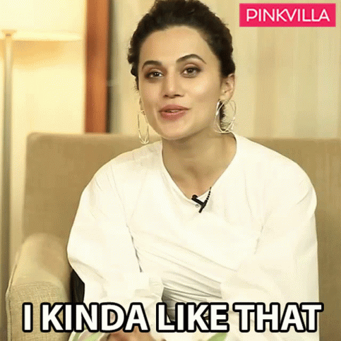 A Woman Sitting On A Couch With A Pinkvilla Logo Behind Her GIF