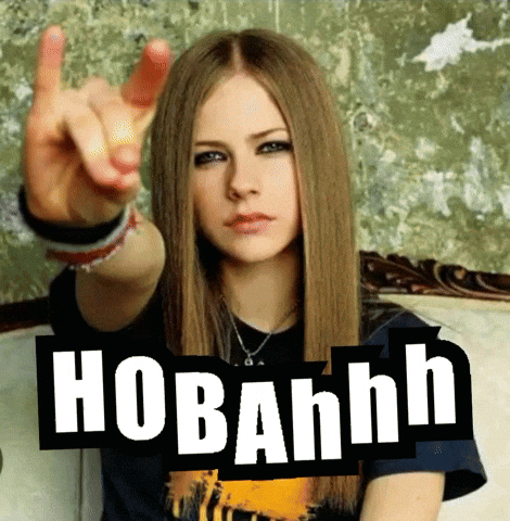 A Woman Sitting On A Couch With A Sign That Says Hobahnh On It GIF
