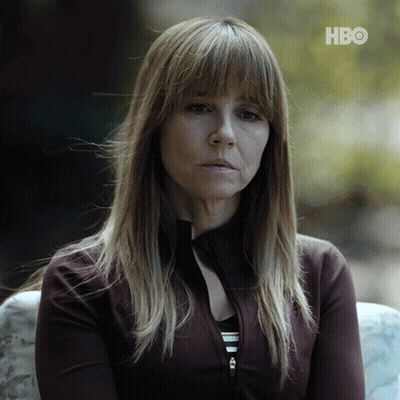 A Woman Sitting On A Couch With Hbo Written On The Bottom Right GIF