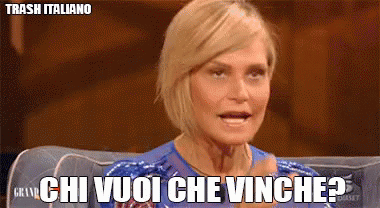 A Woman Sitting On A Couch With The Words Chi Vuoi Che Vinghe Written On Her Face GIF