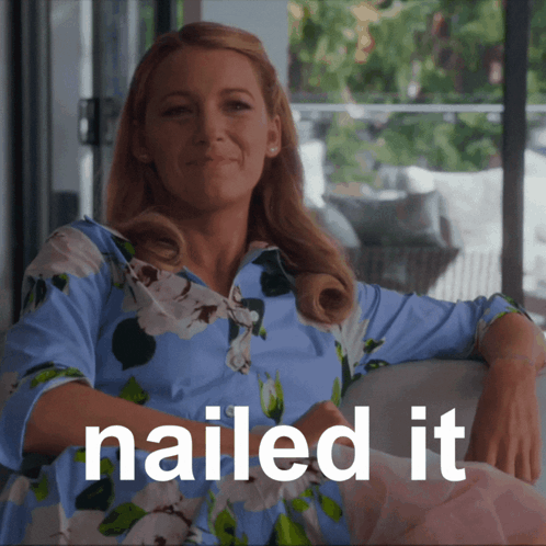 A Woman Sitting On A Couch With The Words Nailed It Written Below Her GIF