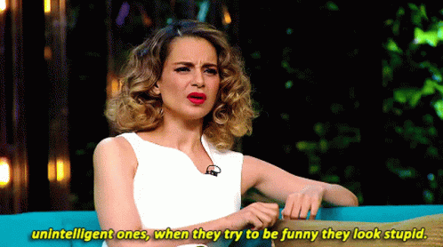 A Woman Sitting On A Couch With The Words Unintelligent Ones When They Try To Be Funny They Look Stupid GIF