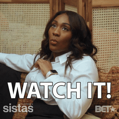 A Woman Sitting On A Couch With The Words Watch It Written On The Bottom GIF