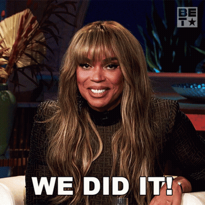 A Woman Sitting On A Couch With The Words We Did It Written On Her Face GIF