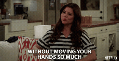 A Woman Sitting On A Couch With The Words Without Moving Your Hands So Much Written Below Her GIF