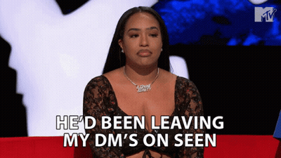 A Woman Sitting On A Red Couch With The Words He 'D Been Leaving My Dm 'S On Seen Behind Her GIF