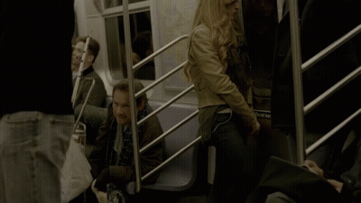 A Woman Sitting On A Train With A Bag That Says ' Subway ' On It GIF