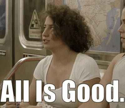 A Woman Sitting On A Train With The Words All Is Good Written On The Bottom GIF