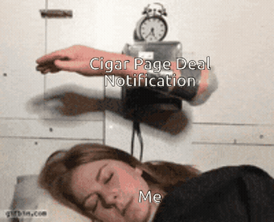 A Woman Sleeping Next To An Alarm Clock That Says Cigar Page Deal Notification On It GIF
