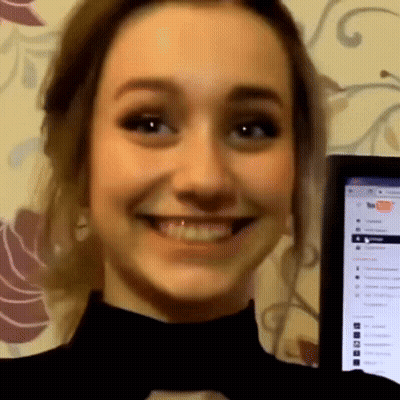 A Woman Smiles In Front Of A Computer Screen That Says ' Firefox ' On It GIF