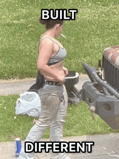 A Woman Smoking A Cigarette In Front Of A Jeep With The Words Built Different Written On The Bottom GIF