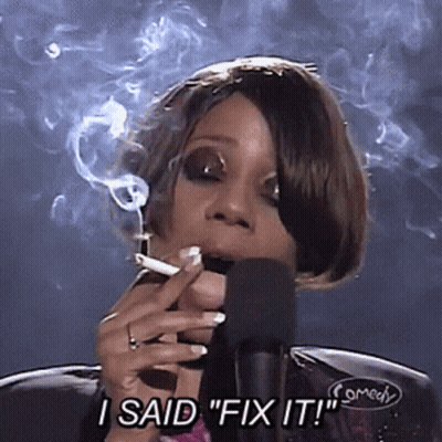 A Woman Smoking A Cigarette In Front Of A Microphone And Saying " I Said Fix It " GIF
