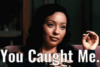 A Woman Smoking A Cigarette With The Words " You Caught Me " Behind Her GIF