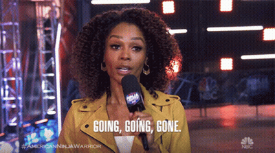 A Woman Speaking Into A Microphone With The Words Going Going Gone Behind Her GIF