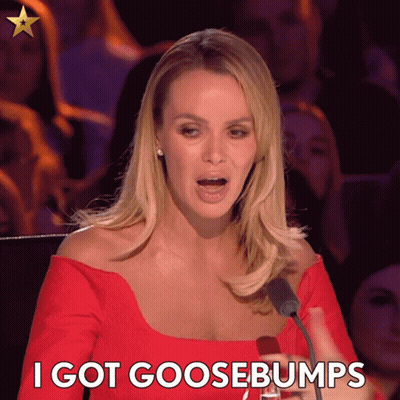 A Woman Speaking Into A Microphone With The Words " I Got Goosebumps " Below Her GIF