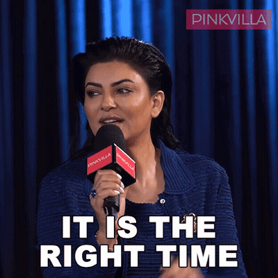 A Woman Speaking Into A Microphone With The Words It Is The Right Time Behind Her GIF