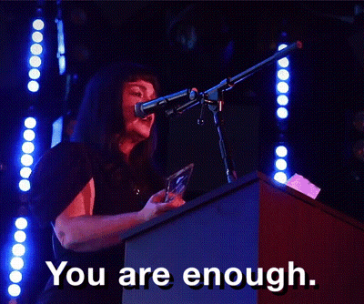 A Woman Speaking Into A Microphone With The Words You Are Enough GIF