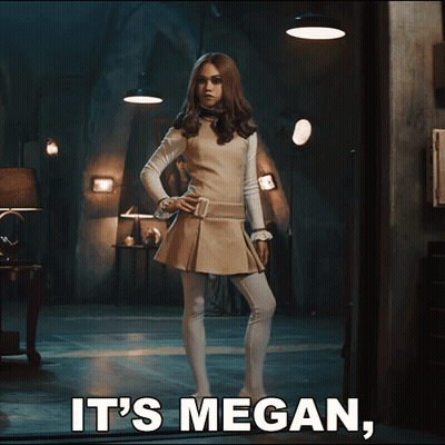 A Woman Standing In A Dark Room With The Words It 'S Megan Below Her GIF