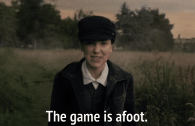 A Woman Standing In A Field With The Words The Game Is Afoot GIF