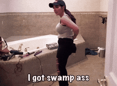 A Woman Standing In Front Of A Bathtub With The Words I Got Swamp Ass Above Her GIF