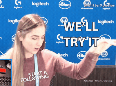 A Woman Standing In Front Of A Blue Background That Says Logitech On It GIF