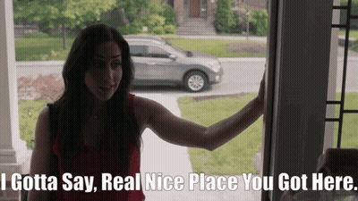 A Woman Standing In Front Of A Door That Says " I Gotta Say " GIF