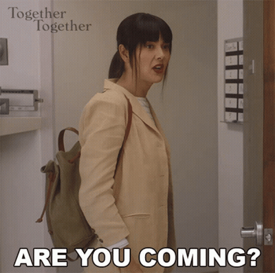 A Woman Standing In Front Of A Door With The Words " Are You Coming " On The Bottom GIF