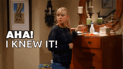 A Woman Standing In Front Of A Dresser With Aha I Knew It Written Above Her GIF